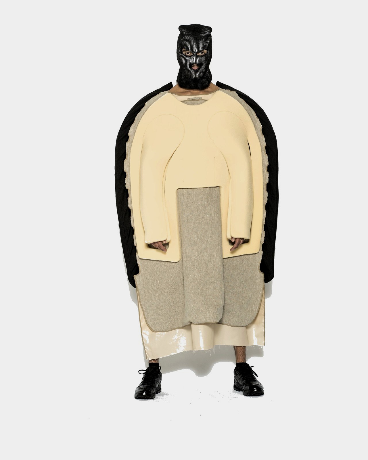 Cream padded torso piece over raw linen with knit mask