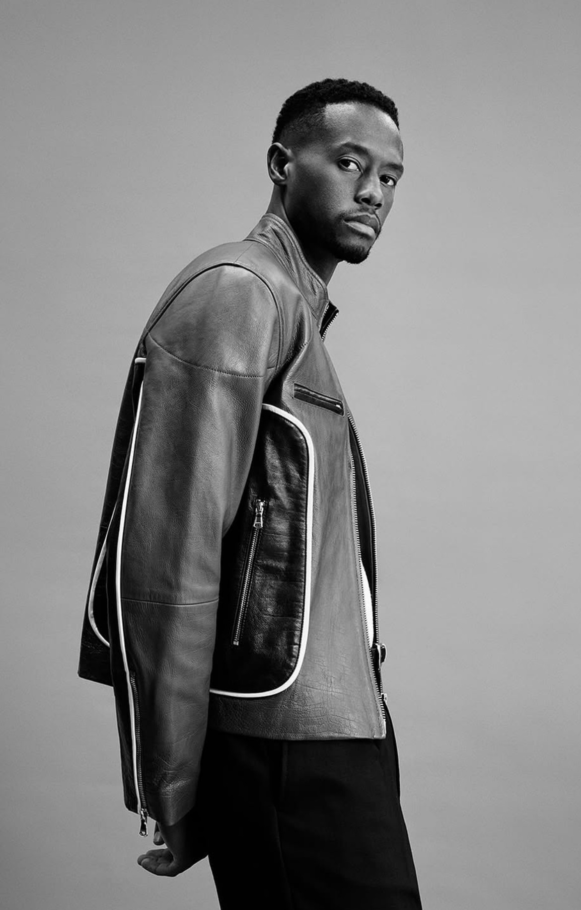 Leather biker jacket with contrast piping, side profile